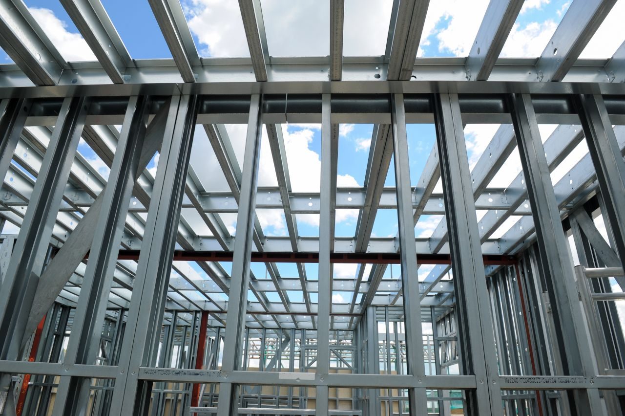 The light gauge steel frame from inside the rooftop box, floor joists and bracing open to the sky